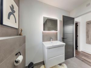 a white bathroom with a sink and a shower at Lodge One - Uk42796 in Llangefni +4 photos