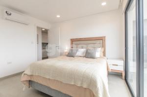 Ένα ή περισσότερα κρεβάτια σε δωμάτιο στο Elegant 1 Bedroom Apt In Ciudad Del Este +30 φωτογραφίες
