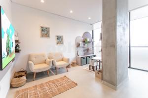 Μια τηλεόραση ή/και κέντρο ψυχαγωγίας στο Elegant 1 Bedroom Apt In Ciudad Del Este