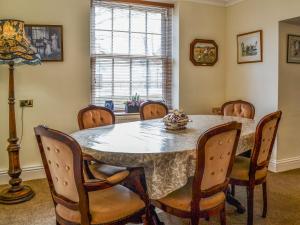 a dining room with a table and chairs at Beckbridge House in Pickering