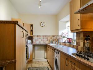 a kitchen with a sink and a dishwasher at Beckbridge House in Pickering +15 photos