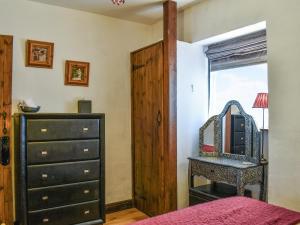 Voodi või voodid majutusasutuse Stoney End Cottage toas