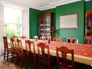 a dining room with a large table and chairs at Abbott's Farm in Horbling