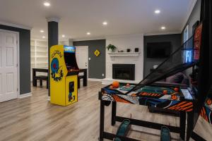a living room with a video game system and a game console at Modern Stay on Green Valley - 2.5 Mi to Downtown in Sunset Hills