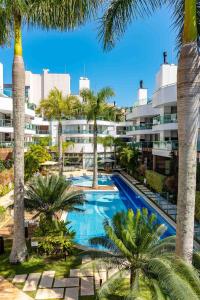 Piscina de la sau aproape de Boulevard Bombinhas - Apartamento em Condo com Piscina