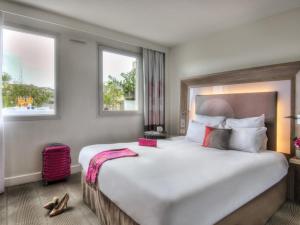 Postel nebo postele na pokoji v ubytování Novotel Marseille Centre Prado Vélodrome + 172 fotografií