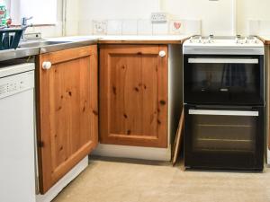 Köök või kööginurk majutusasutuses Cricketers Cottage