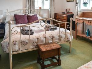 Voodi või voodid majutusasutuse Cricketers Cottage toas +14 fotot