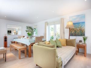 a living room with a couch and a table at Lark Rise in Northam