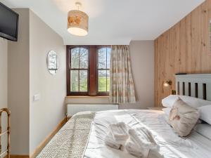 Postel nebo postele na pokoji v ubytování Tancred Cottage + 12 fotografií