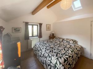 Кровать или кровати в номере The Farmhouse At Halllin Bank - Uk49040