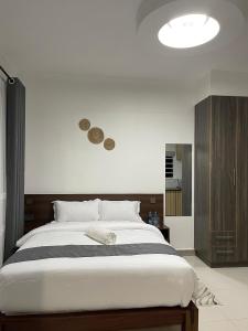 a bedroom with a large bed in a room at Ckay homes eldoret in Eldoret