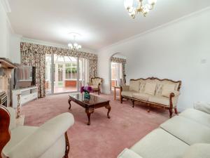 a living room with a couch and a table at The Great Escape in Ipswich