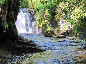 a waterfall in the middle of a river at Brewhouse - Uk48743 in Llandybie
