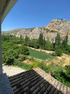 a view from the porch of a house with a mountain at Casa azul in Nerpio