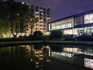 an external view of a building at night at Mercure Hotel Dortmund Messe in Dortmund