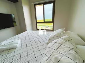 Ένα ή περισσότερα κρεβάτια σε δωμάτιο στο Vg Sun Cumbuco by Inspira Ceará