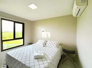 Ένα ή περισσότερα κρεβάτια σε δωμάτιο στο Vg Sun Cumbuco by Inspira Ceará