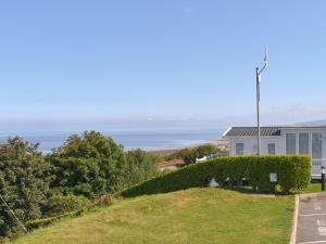 a view of the ocean from a house at Sunrise Cottage - Uk35813 in Llanddulas