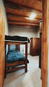 a bedroom with a bunk bed in a room at Ciruelos del Sur - San Rafael Mendoza in San Rafael