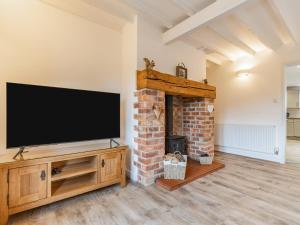Televiisor ja/või meelelahutuskeskus majutusasutuses The Old Farmhouse