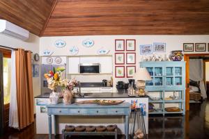 TV/trung tâm giải trí tại ANTIGUA RESIDENCE - 1102 - Beach Cottage