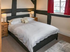 Un ou plusieurs lits dans un hébergement de l'établissement The Cottage