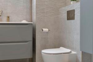 a bathroom with a white toilet and a roll of toilet paper at The Barony Fox in Edinburgh
