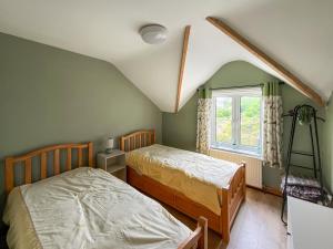 Voodi või voodid majutusasutuse Swan Cottage toas +6 fotot