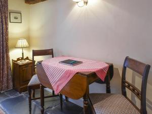 a table with a book on top of it in a room at Church Street in Ambleside
