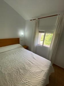 Ένα ή περισσότερα κρεβάτια σε δωμάτιο στο Casa azul +2 φωτογραφίες