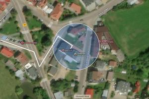 a map of a street with a circle in it at Apartamenty Bistro12 in Sokoły