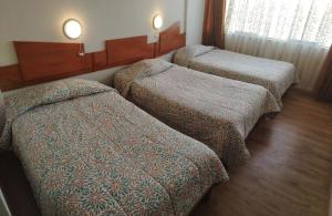 Ліжко або ліжка в номері Nayras Puno Hotel +3 фото