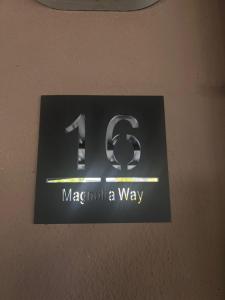 a sign on a wall that saysmt macomucitus a way at Danlavie in Tyger Valley
