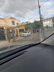 a car parked in front of a fence at Private, centrally located, spacious and comfortable residence in Hermosillo