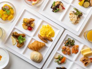 a group of plates of food on a table at ibis Styles Kyoto Station in Kyoto