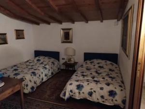 Кровать или кровати в номере La Casa di Rita