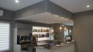 a kitchen with a counter and a large mirror at Primo Hotel in Marciana Marina