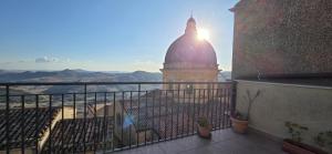 a building with a dome on top of a balcony at Al Centro in Gangi