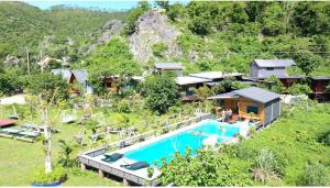 an aerial view of a resort with a swimming pool at Cat Ba Love House in Cat Ba