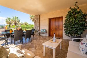 a living room with a couch and a table at Ideal Property Mallorca - Son Manyo 223 in Sa Pobla +32 photos