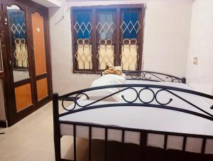 Postel nebo postele na pokoji v ubytování Ezraa Homes Homestay Single BHK + 5 fotografií