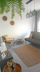 a living room with a couch and a table at Hawaii house in Puerto del Rosario