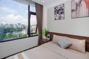 Postel nebo postele na pokoji v ubytování La Passion - Tay Ho Hanoi One Bedroom Apartment!