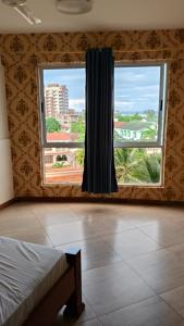 Ένα ή περισσότερα κρεβάτια σε δωμάτιο στο 2 bedrooms in Nyali close to the beach