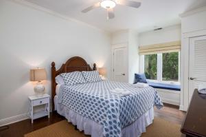 a white bedroom with a bed and a window at 111 Cardinal Crest - Resort Access & Golf Cart Included! in Fripp Island +90 photos