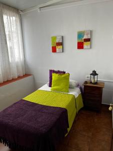 Una cama o camas en una habitación de Residencial Primavera