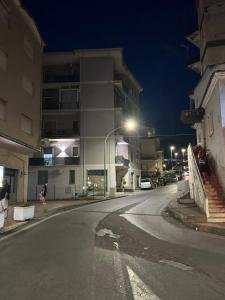 an empty street in a city at night at La Rotonda in Diamante
