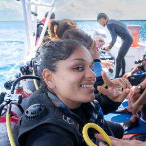 a group of people on a boat in the water at Be Diving House in Cozumel