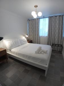 Postel nebo postele na pokoji v ubytování Pr Rentals Expectacular Location